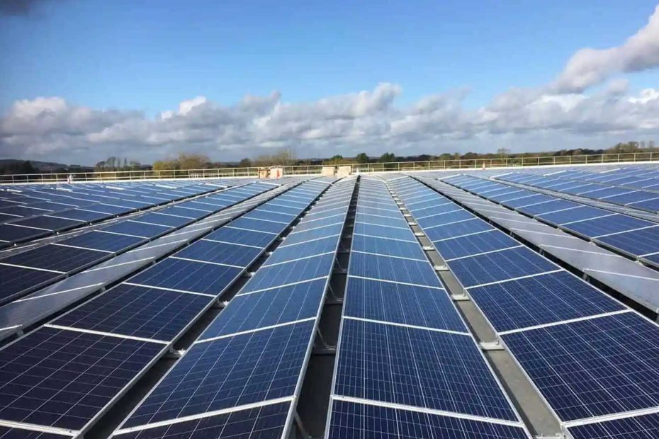 A vast array of solar panels under a clear blue sky, representing the OCEC solar panel project focused on sustainability and renewable energy initiatives.